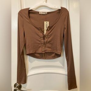 Sexy long sleeve top with chain cross.